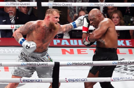 Jake Paul lands a left punch to the side of Mike Tyson’s head