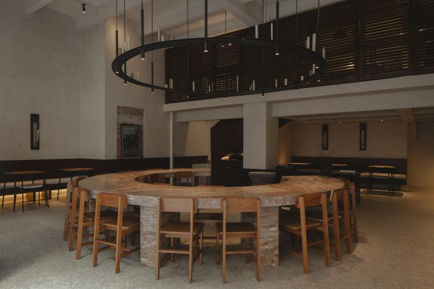 Worc Studio centres circular stone table at “reverential” Mexico City restaurant